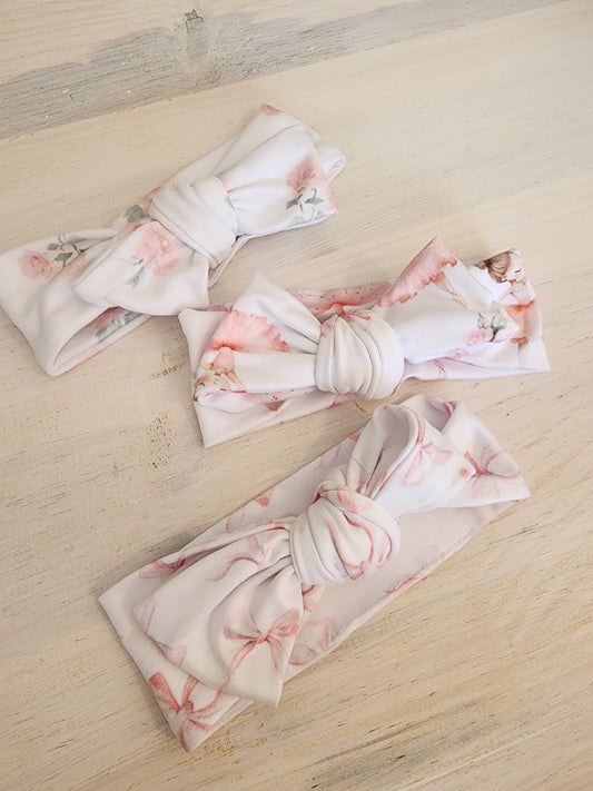 Set of floral headbands on a wooden surface