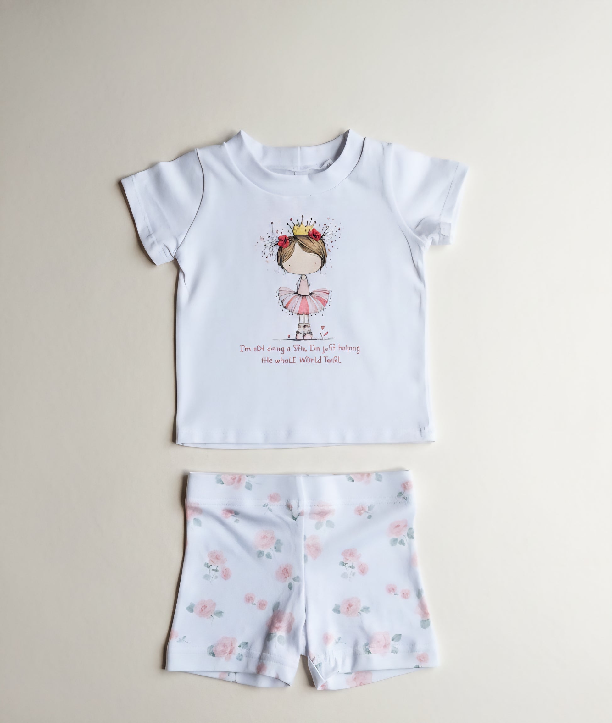 Children's t-shirt and shorts set with a printed design on a beige background